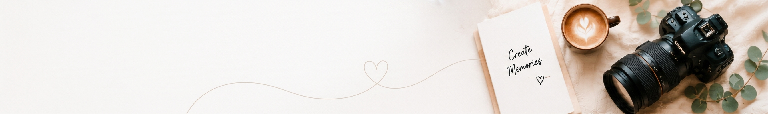 Flat-lay: notebook 'Create Memories', camera, latte and eucalyptus